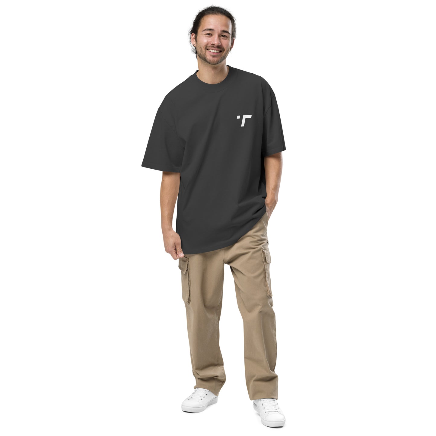 Model wearing a relaxed-fit oversized t-shirt in breathable, lightweight fabric with drop-shoulder design and longer hem. Perfect for casual wear or workouts, offering comfort and unrestricted movement