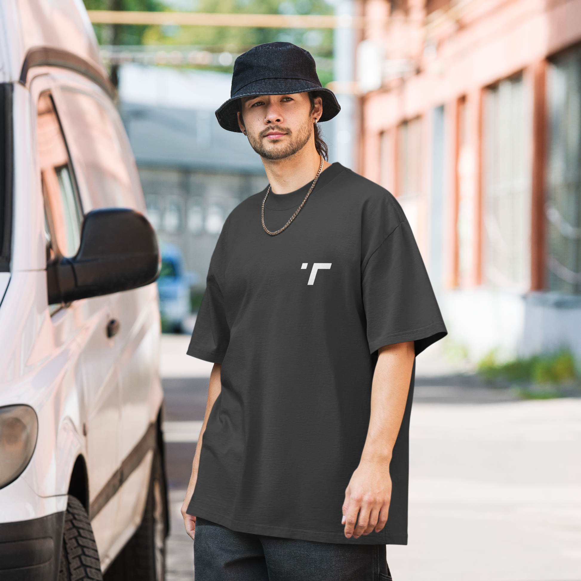 Model wearing a relaxed-fit oversized t-shirt in breathable, lightweight fabric with drop-shoulder design and longer hem. Perfect for casual wear or workouts, offering comfort and unrestricted movement